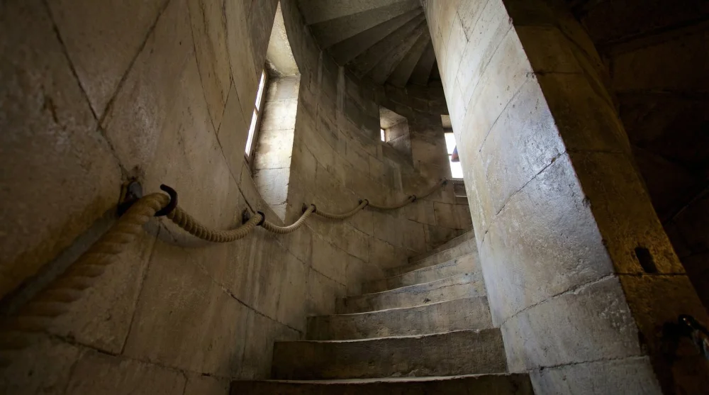 The narrow, slanted spiral staircase leading to the top of St. Peter's dome